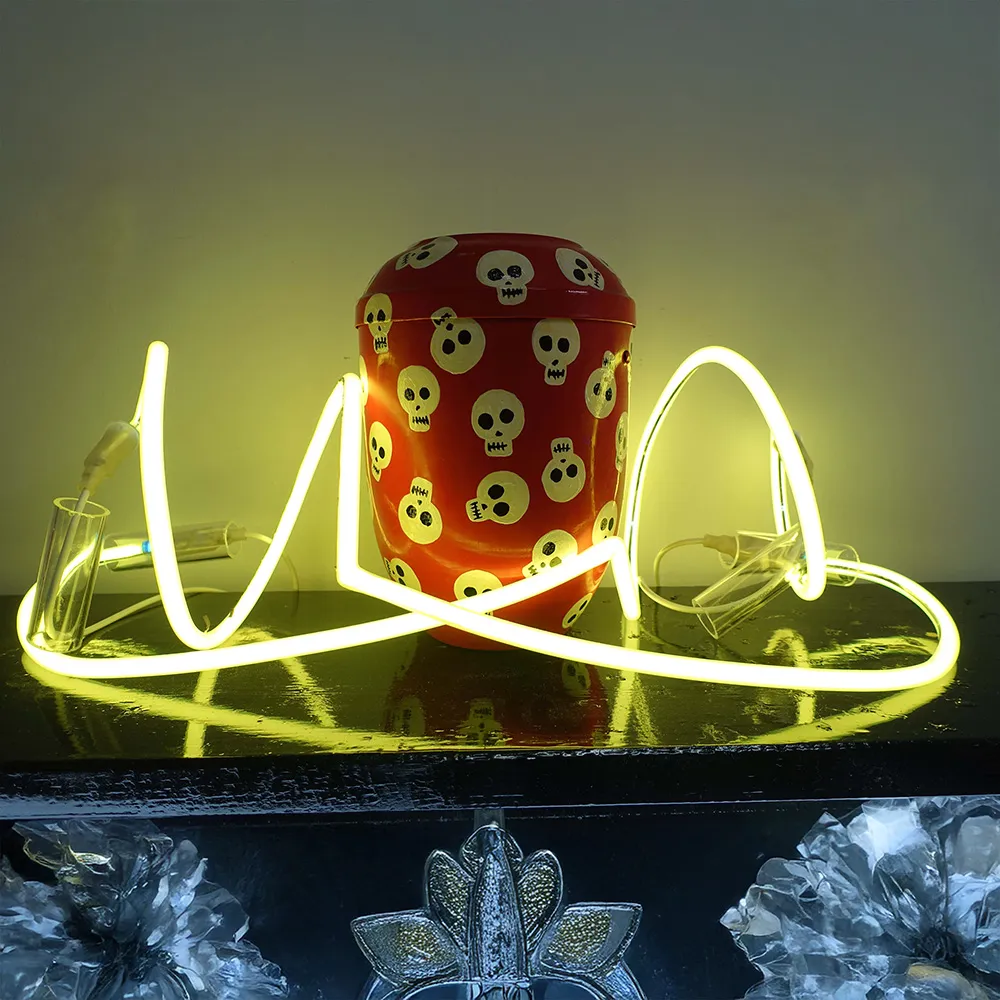 Chris Bleicher's own urn with neon installation